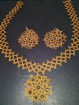 Earring and Pendant from 10 Tatting Designs published by Coats